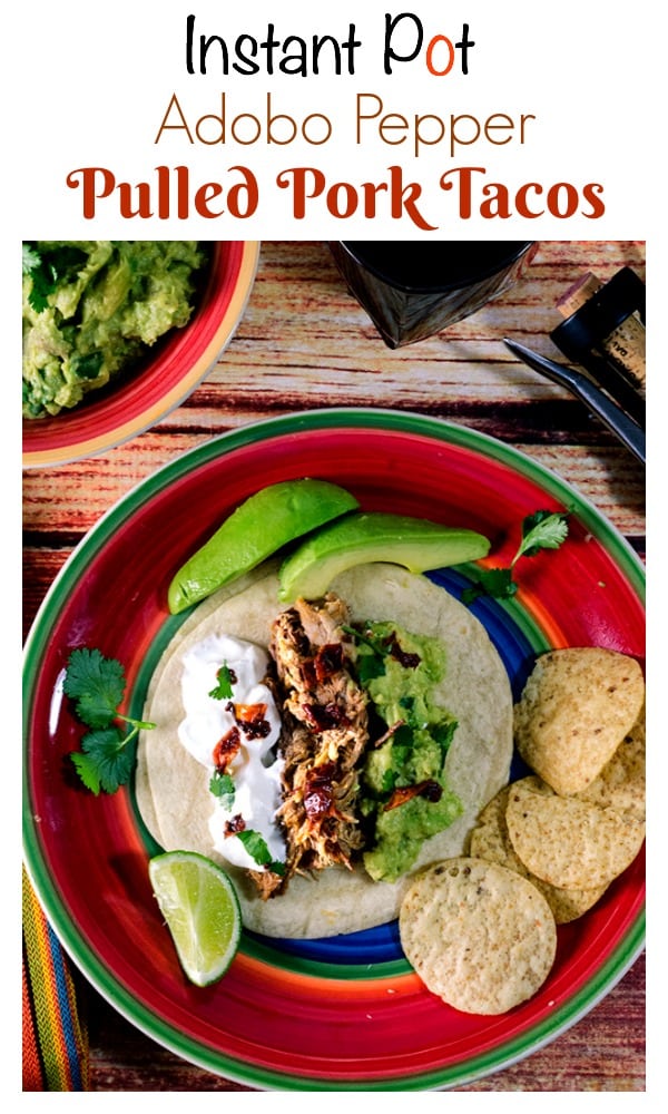 These Instant Pot Pork Tacos are cooked in an adobo pepper sauce and garnished with fresh guacamole and sour cream, making for a fast and flavorful weeknight meal that is perfect for family and guest alike.