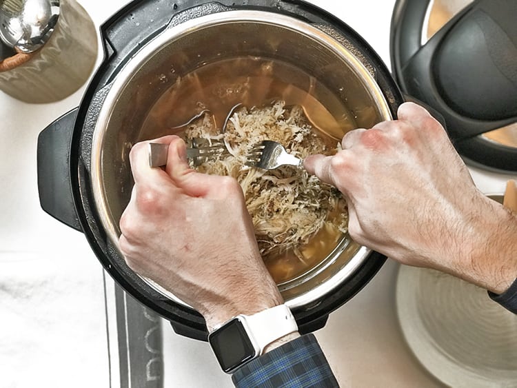 Shredding meat for instant pot hot turkey sandwich recipe.